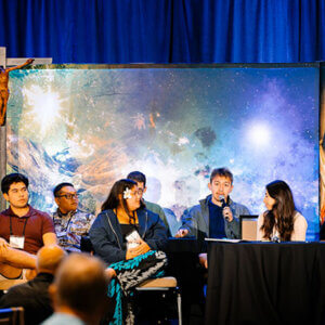 Stephen Garcia, with microphone, sits on a panel at the 2026 Province Assembly in Dayton, Ohio.