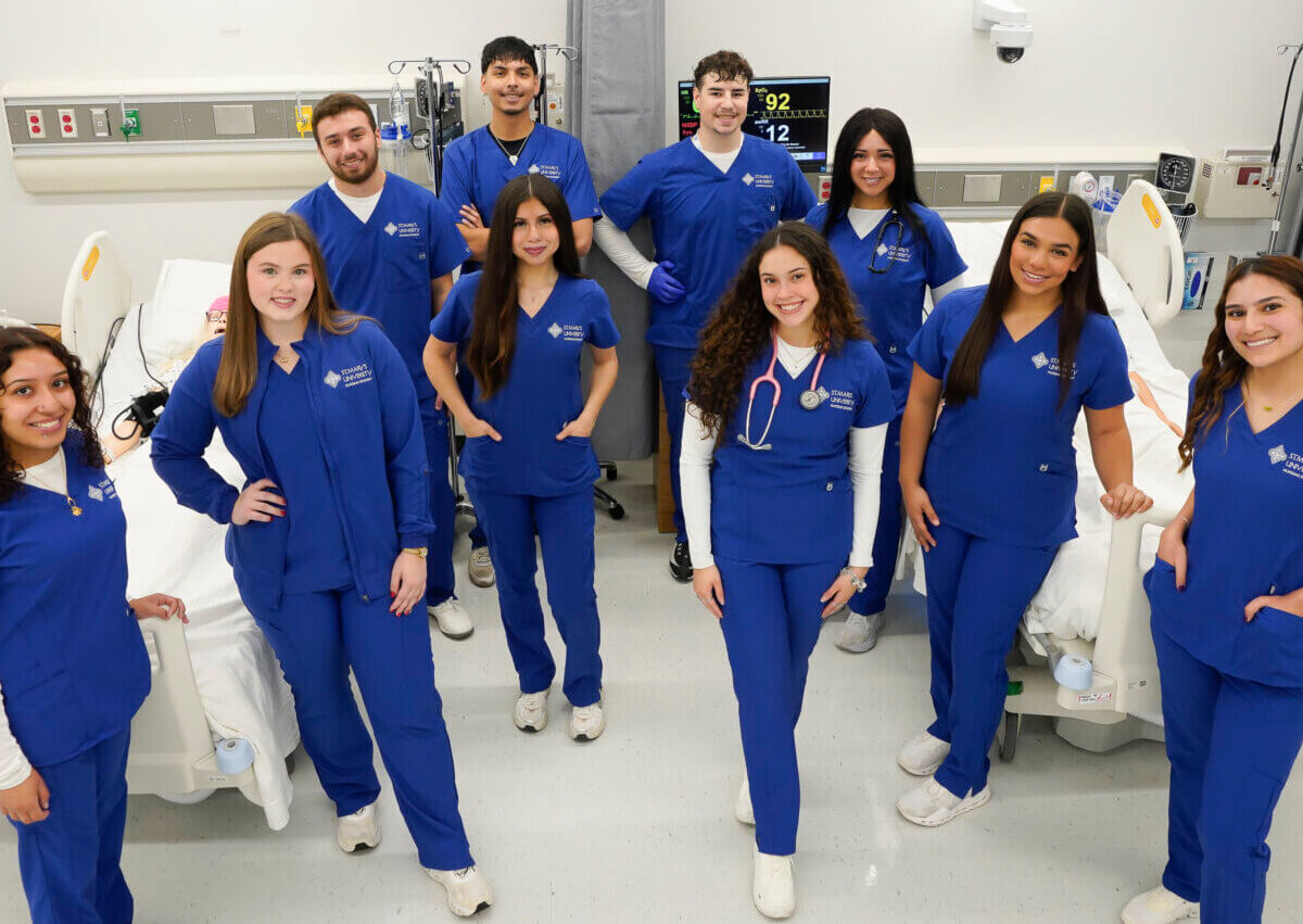 First group of nursing students take a group photo together.