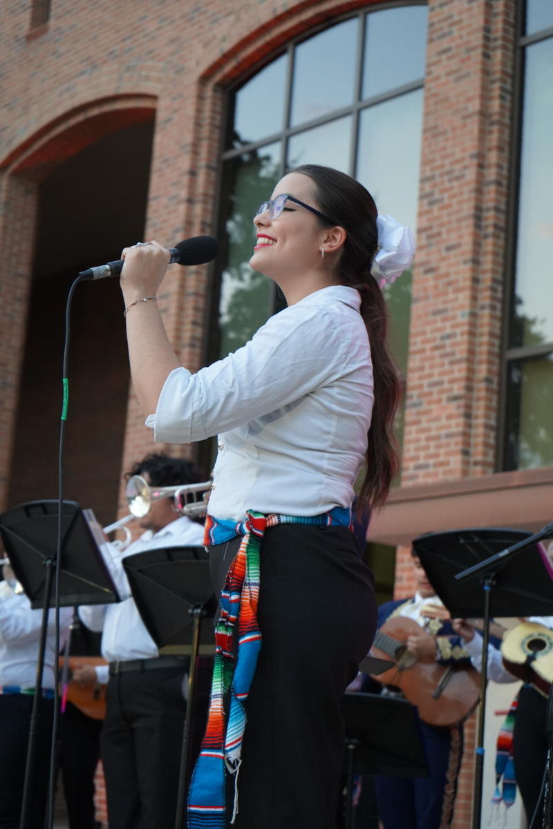 Female singing in a microphone.