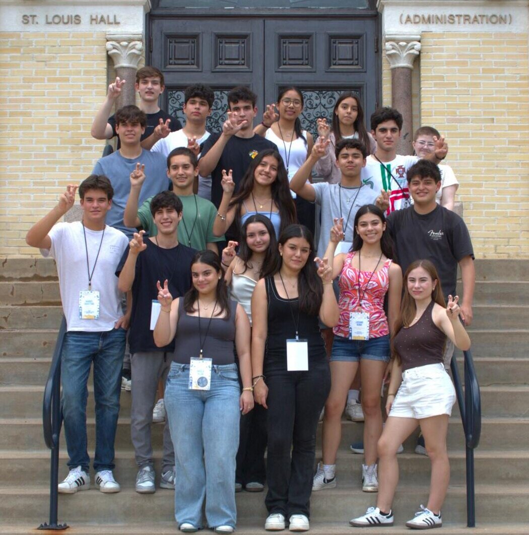 Students show their Rattler pride with the Fangs Out hand gesture.