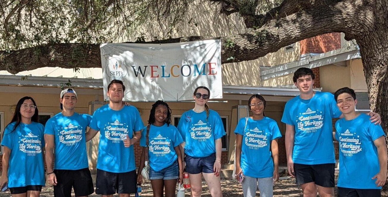 Students wearing matching Continuing the Heritage day of service shirts.